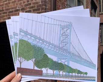 May include: A set of four prints featuring a black and white line drawing of a bridge with a blue sky background. The bridge is drawn in a realistic style and includes details like the suspension cables and the road deck. The prints are perfect for adding a touch of urban style to any room.