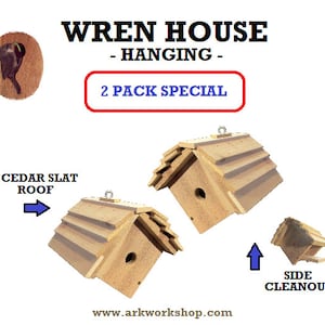 May include: Two wooden wren houses with cedar slat roofs, hanging from a hook. The houses have a side cleanout for easy cleaning.  "WREN HOUSE - HANGING - 2 PACK SPECIAL" is written on the image.