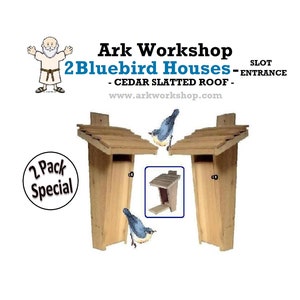 May include: Two wooden bluebird houses with cedar slatted roofs. The houses have a slot entrance and are sold as a two-pack special. The image also shows a bluebird perched on each house.