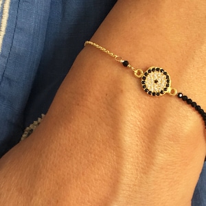 sparkly black spinel evil eye bracelet. delicate bracelet