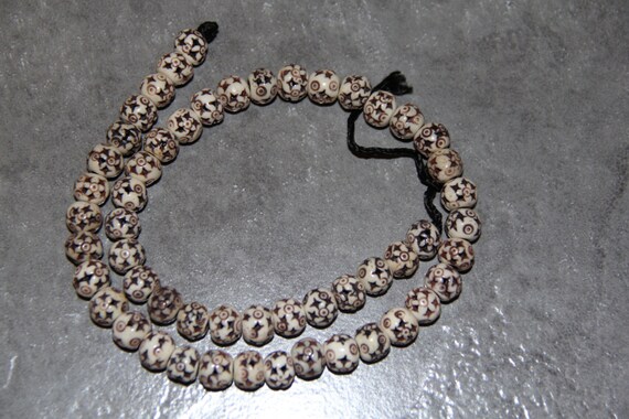 Buffalo Bone Star Carved Beads, 18" long full strand