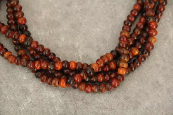 Horn 8x6mm roundel beads,  18" long full strand