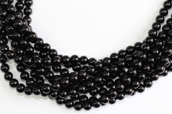 Black Onyx  2-14mm smooth round beads 16" length full strand