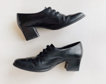 Vintage 80s black leather block heeled shoes.