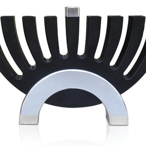May include: A black menorah with a silver base. The menorah has nine candle holders, arranged in a semi-circle shape. The base is a silver arch.