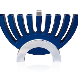 May include: A blue and silver menorah with nine candle holders. The menorah is shaped like a half-circle with a silver base.
