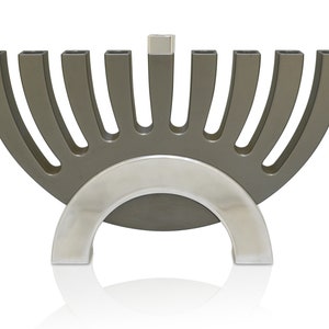 May include: A silver and gray menorah with nine candle holders. The menorah is shaped like a half-circle with a silver base.