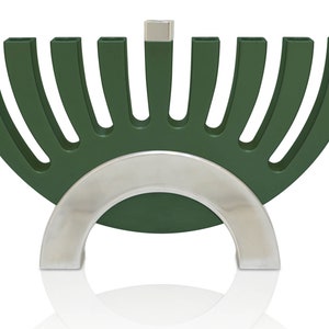 May include: A green menorah with a silver base. The menorah has nine candle holders and is shaped like a half-circle.