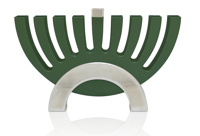 May include: A green menorah with a silver base. The menorah has nine candle holders and is shaped like a half-circle.