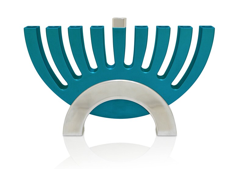 May include: A teal blue menorah with a silver base and nine candle holders. The menorah is shaped like a half-circle.