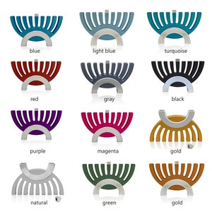 May include: A set of 12 menorahs in various colors, including blue, light blue, turquoise, red, gray, black, purple, magenta, gold, natural, green, and gold. Each menorah is made of metal and has a unique design.