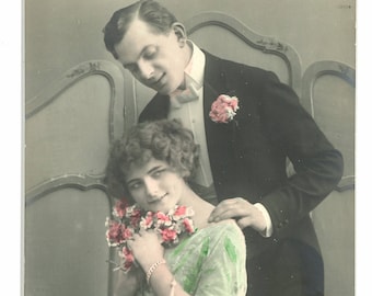 Hand colored "romantic" postcard of couple. Hand tinted RPPC. German