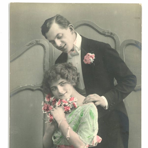 Hand colored "romantic" postcard of couple. Hand tinted RPPC. German