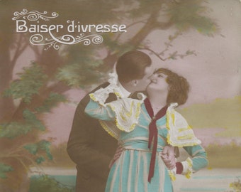 Hand colored "romantic" postcard of kissing couple