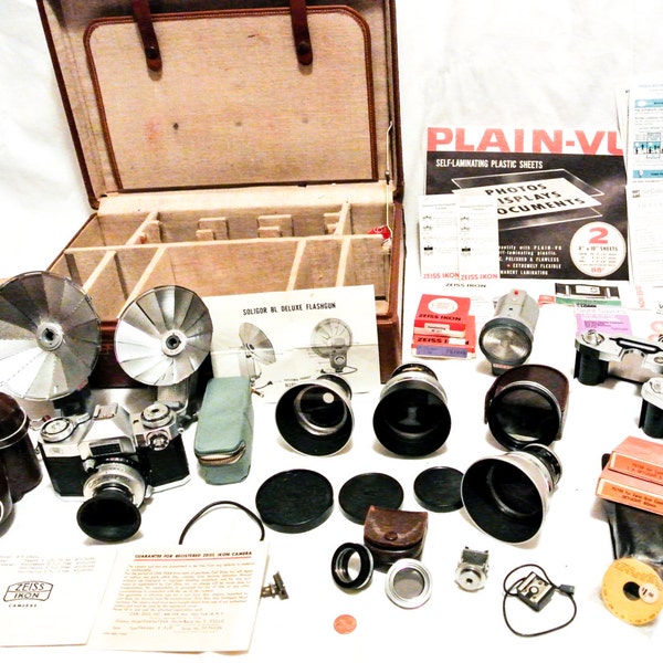Rare Zeiss Ikon Outfit in Original Leather case; 4 Zeiss Lenses, 3 film cartridges, flashes, fliters, documentation & more