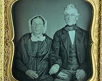 Sharp sixth plate daguerreotype  of an affectionate elderly couple. Scarce case. Identified and dated-1849