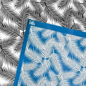 May include: A rectangular blue stencil sheet featuring a white palm leaf pattern and the word Paku printed in the top left corner. The stencil is positioned over a black and white background that displays the same palm leaf design in high contrast.