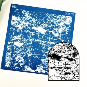 May include: A blue and white stencil with a cracked texture design. The stencil is labelled "SKU# 255".