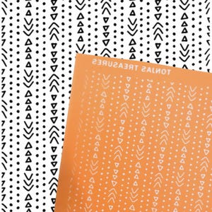 May include: A rectangular orange stencil sheet featuring a repeating pattern of vertical lines, triangles, and chevron arrows. The text TONJA'S TREASURES is printed along the top edge. The pattern is also displayed in black on a white background.