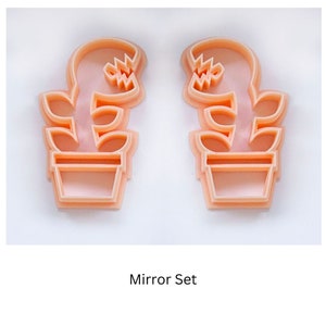 monster plant clay cutter, fly trap polymer clay cutting tool The cutters are mirror images of each other. The text "Mirror Set" is below the cutters.