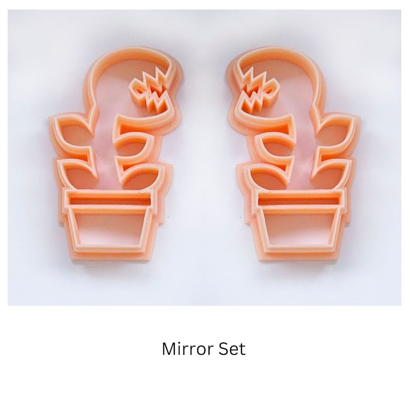 monster plant clay cutter, fly trap polymer clay cutting tool The cutters are mirror images of each other. The text "Mirror Set" is below the cutters.
