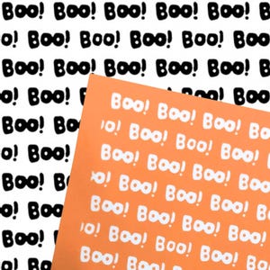 May include: A rectangular sheet of orange paper featuring a repeating pattern of the word Boo! printed in white, layered over a white background that displays the same repeating pattern of the word Boo! printed in black ink.