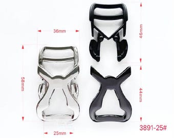 May include: Two metal buckles, one silver and one black, with a '3891-25#' label. The buckles are 5.8 cm tall, 4.4 cm wide, and 3.6 cm long.