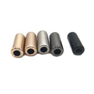 May include: Five metal cord end caps in different finishes: gold, rose gold, silver, gunmetal, and black.