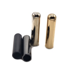 May include: Four metal cord end caps in gold, silver, and black.