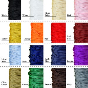 May include: A collection of spools of cord in various colors, including black, white, light beige, pink, yellow, orange, red, dark red, light blue, blue, dark blue, purple, olive green, green, brown, and grey.