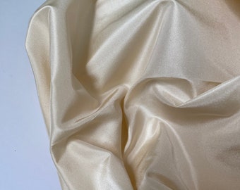 Beautiful pale gold silk taffeta, 54" wide, available in multiple lengths for home decor, crafting, apparel. Free swatches.