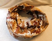 tan flannel infinity scarf features and Amish wood star design