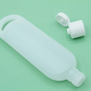 1 oz lotion bottle- Natural colored tottles with hang loop- travel size bottle- sample size bottle- plastic bottle with lid-set of 24