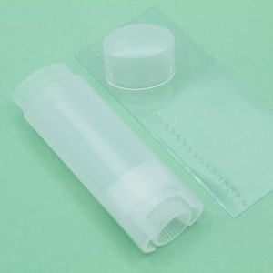 Natural colored oval lip balm tube with lid and turn wheel on the bottom- Set of 40