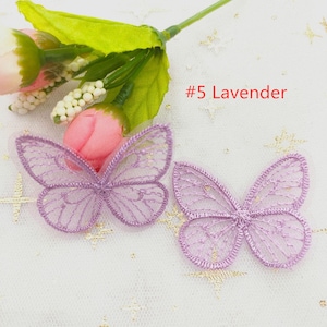 May include: Two purple lace butterfly appliques on a white background. #5 Lavender