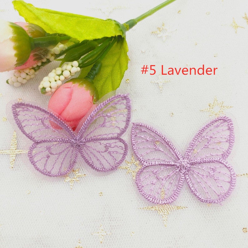 May include: Two purple lace butterfly appliques on a white background. #5 Lavender