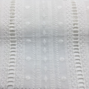 May include: White cotton fabric with an embroidered design featuring a repeating pattern of geometric shapes and circles.