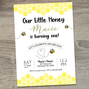 May include: A yellow and white bee-themed first birthday party invitation with a honeycomb pattern background. The invitation says "Our Little Honey Macie is turning one!" and includes the date, time, and location of the party. It also includes the text "Let's Celebrate Her Bee-Day!"