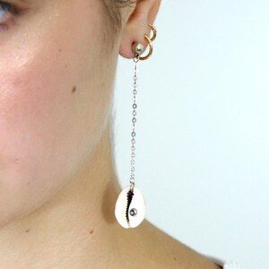earring with a shell pendant