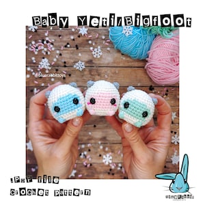 May include: Three crocheted baby Yeti/Bigfoot dolls in blue, pink, and green, each with black eyes and small gray ears. The dolls are held in hands, with yarn and snowflakes in the background. The text "Baby Yeti/Bigfoot" and "PDF file Crochet pattern" are visible.