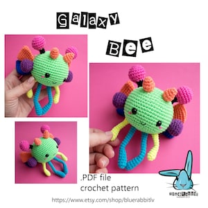 May include: A crochet pattern for a colorful galaxy bee amigurumi toy. The bee is green with rainbow legs and a purple, orange, and pink galaxy design. The pattern is available as a PDF download.