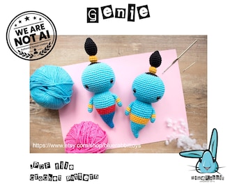 May include: Two handmade crochet genie dolls with bright blue bodies, black topknots, and yellow accents. The dolls are displayed with a ball of blue yarn, a ball of pink yarn, a crochet hook, and a sewing needle. The text reads genie and PDF file crochet pattern.