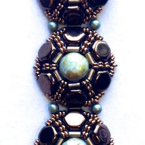 May include: A beaded bracelet with a repeating pattern of dark brown, light brown, and green beads. The bracelet features a central focal point of a larger green bead surrounded by smaller dark brown beads.