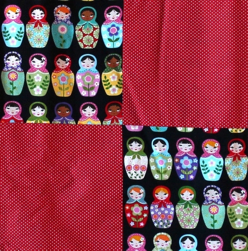 Hand made baby quilt with matryoshka doll motif juxtaposed to red and white polka dots.