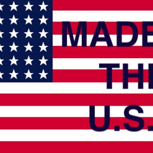 May include: An American flag with 13 red and white stripes and 50 white stars on a blue field. The text "MADE IN THE U.S.A." is printed in black letters on the flag.