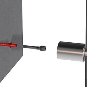 May include: A close-up of a glass panel being mounted to a wall using a metal bracket and a screw. The screw is attached to a red plastic anchor in the wall.