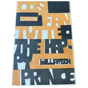 May include: A rectangular book cover featuring a tan background with bold black block lettering and abstract shapes. The text includes the words MOZART, FAN, TUTTE, THE HAP, PY, PRINCE, and WILLIAMSON arranged in a layered, graphic design composition.