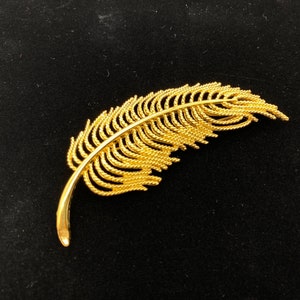 Vintage Monet gold tone feather brooch large lapel pin Signed quill