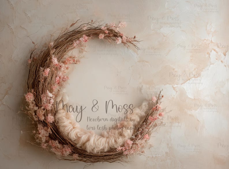 May include: A circular newborn photography prop featuring a woven twig wreath adorned with pink flowers. The center is filled with soft, light-colored fluff. The background is a textured, neutral-toned surface. Text on the image reads "May & Moss" and "Newborn digitals by lori lesh photography."