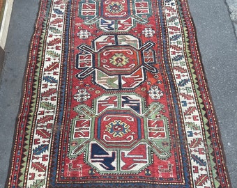 vintage carpet with red background, old antique carpet